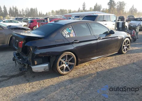 2015 BMW M5 z USA, uszkodzony, nr VIN WBSFV9C57FD595009